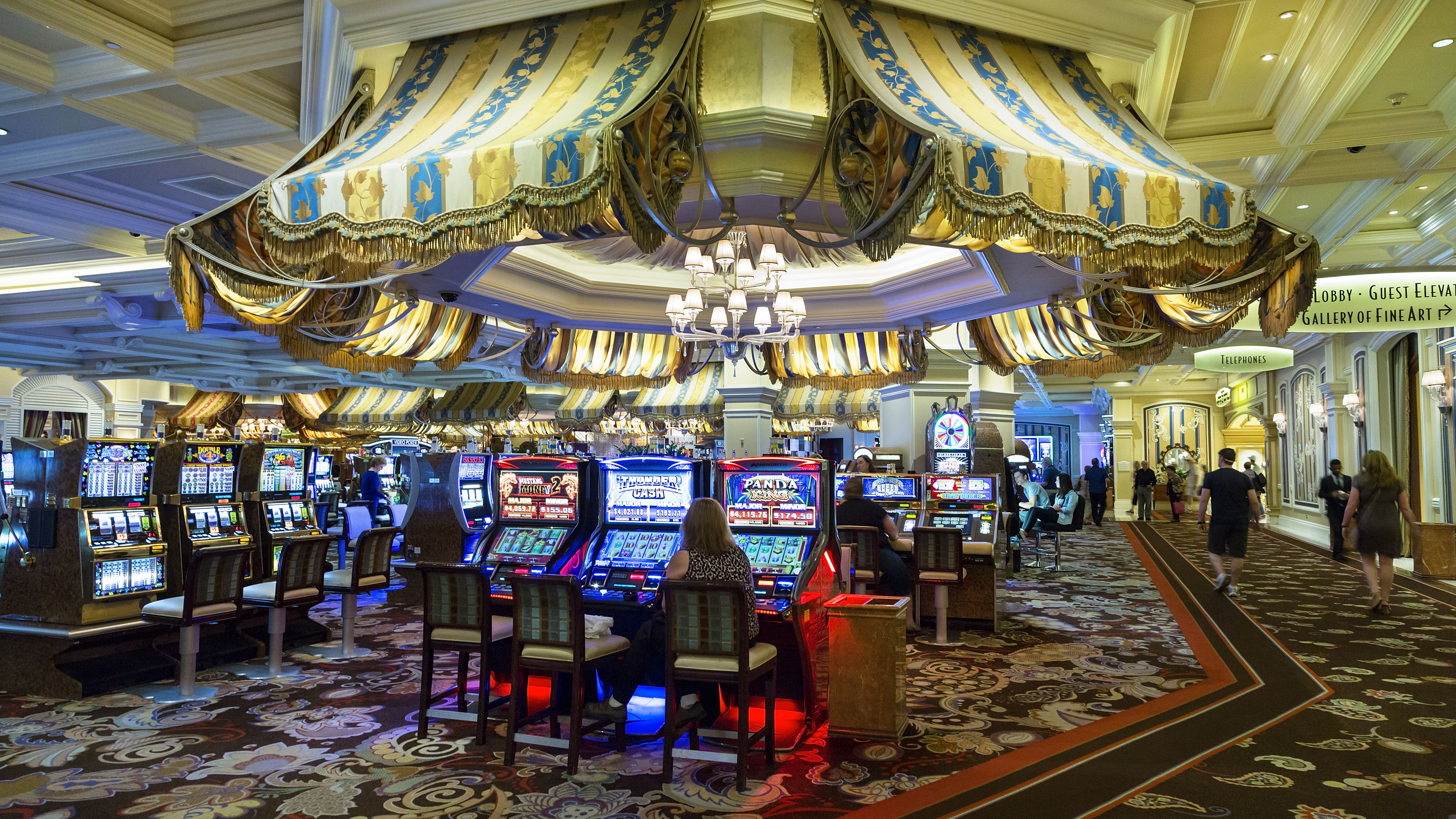 bellagio-hotel--people-playing-slot-machines-461673789-592436b25f9b58f4c0803d88.jpg